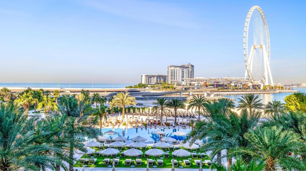 an aerial view of a resort with a ferris wheel at DoubleTree by Hilton Dubai Jumeirah Beach in Dubai