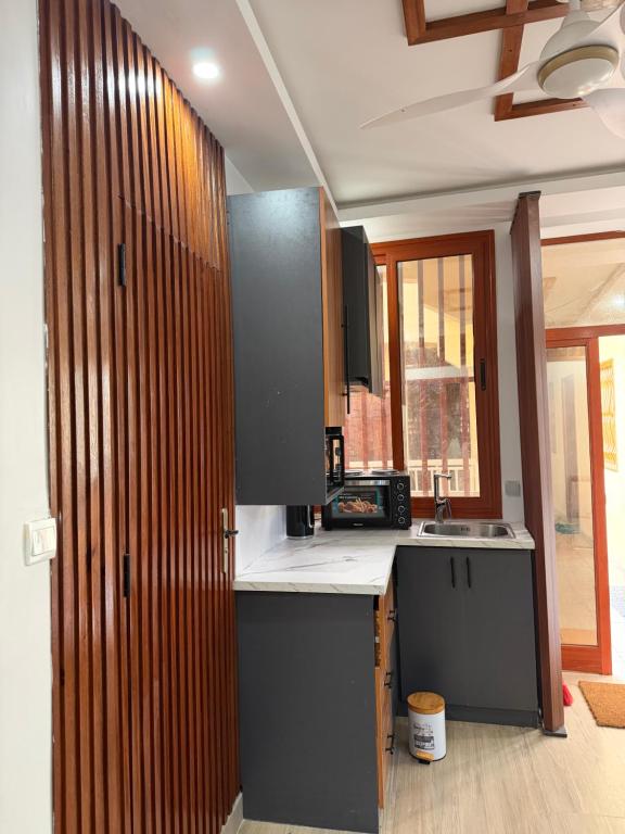a kitchen with a sink and a counter top at Ndiaghan Hébergement in CambÃ©rÃ¨ne