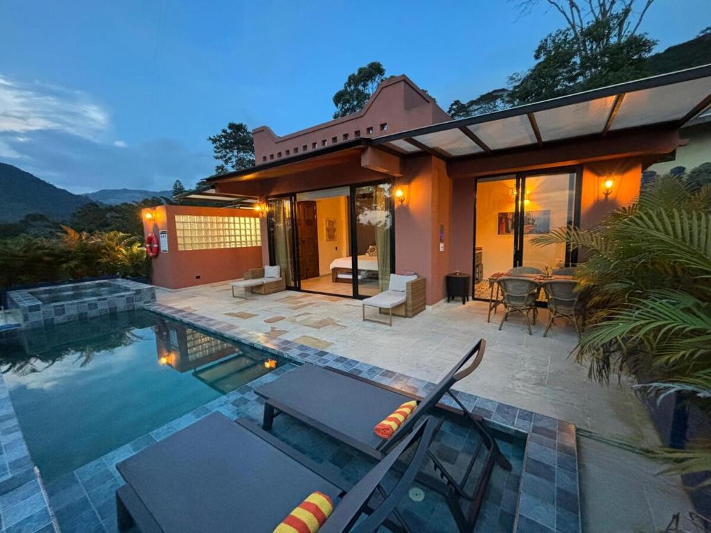 a house with a swimming pool in front of a house at Indigo House, Villa Fez in San Francisco