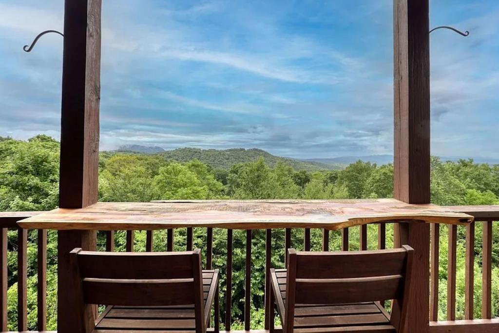 a balcony with chairs and a view of the mountains at Sugar Mountain Condo, Sleep 4, Deck Mountain Views in Sugar Mountain