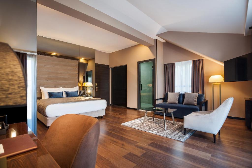 Postel nebo postele na pokoji v ubytování SAINT TEN Boutique Hotel, Small Luxury Hotels