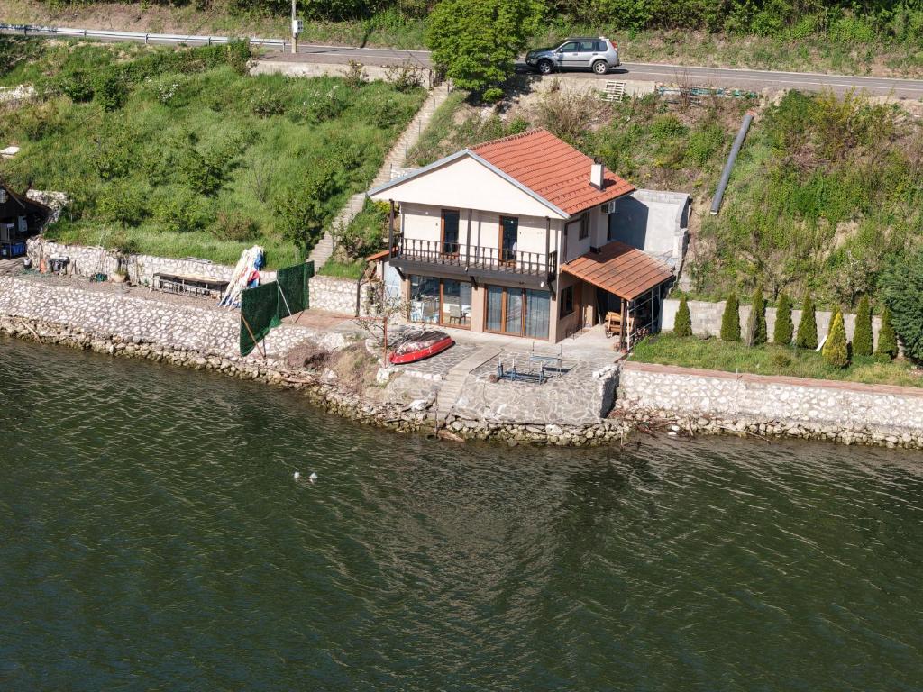 an aerial view of a house on the water at Kuca za odmor Labud in Donji Milanovac
