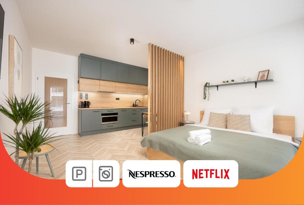a bedroom with a bed and a kitchen in it at Internesto Brno Urban in Brno