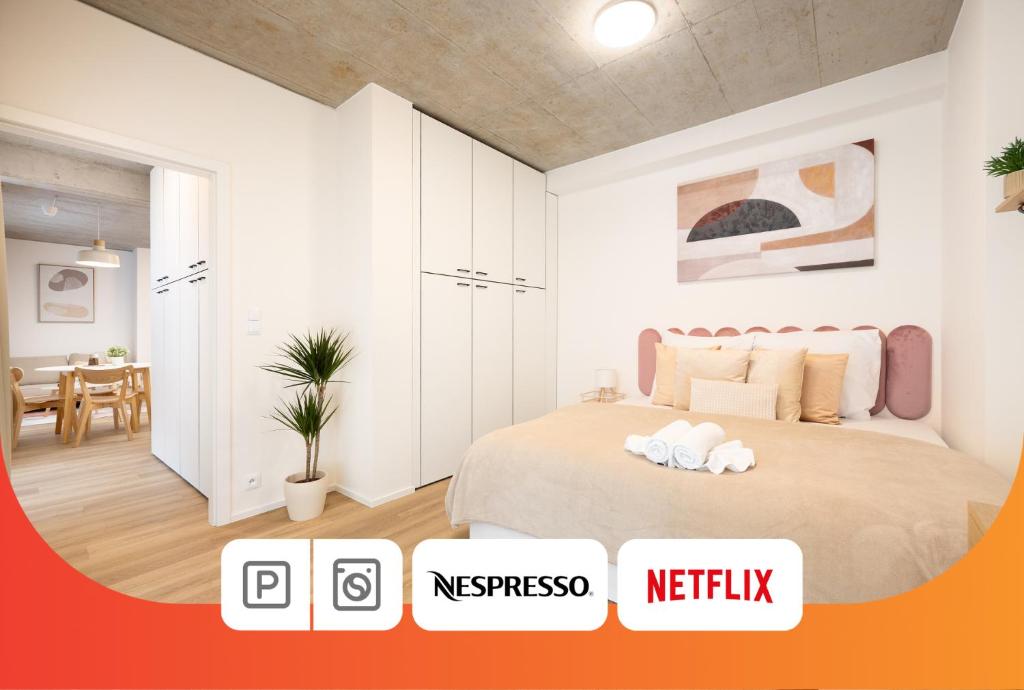 a bedroom with a bed and a dining room at Internesto Brno HUB in Brno