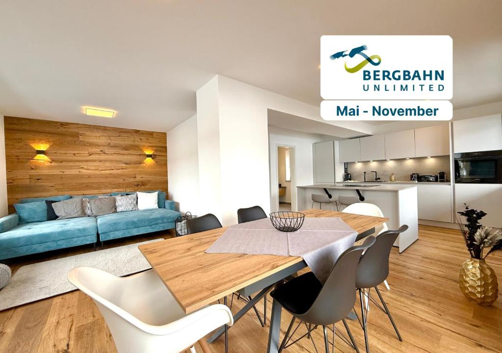 a living room with a table and a couch at Ferienhaus Alpenlodge in Oberstdorf