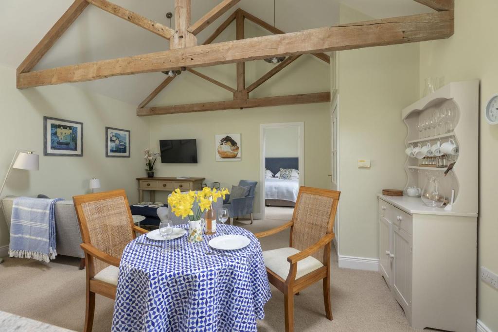 a kitchen and dining room with a table and chairs at The Hat Shop in Hexham