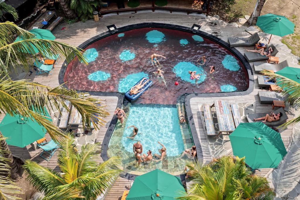 an overhead view of a pool at a resort at The Social - Begadang Gili Air in Gili Islands
