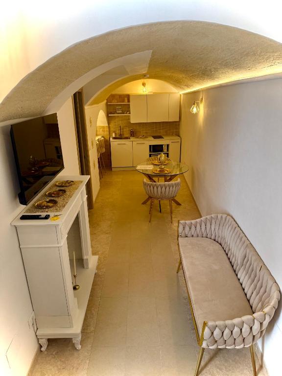 a living room with a couch and a table at Borgo Antico in Grottaglie