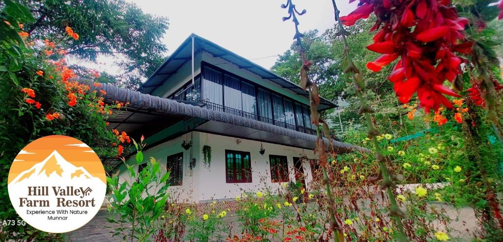 a building with a sign in front of it at Hill valley farm resort in Munnar