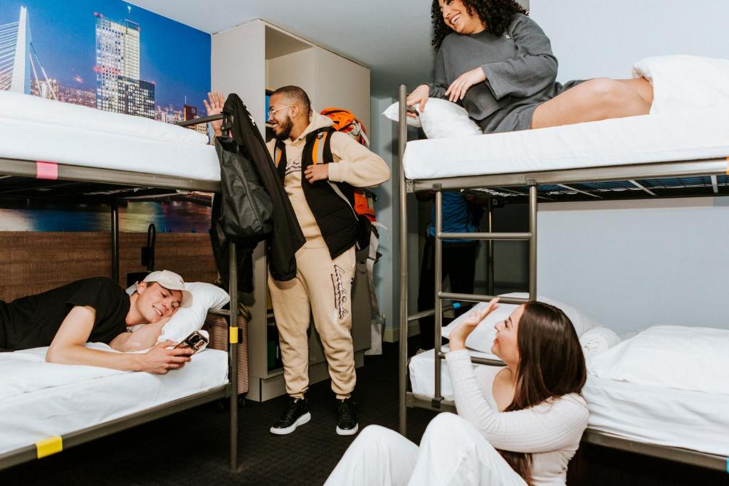 a group of people standing in bunk beds at Rotterdam Teleport Hostel in Rotterdam
