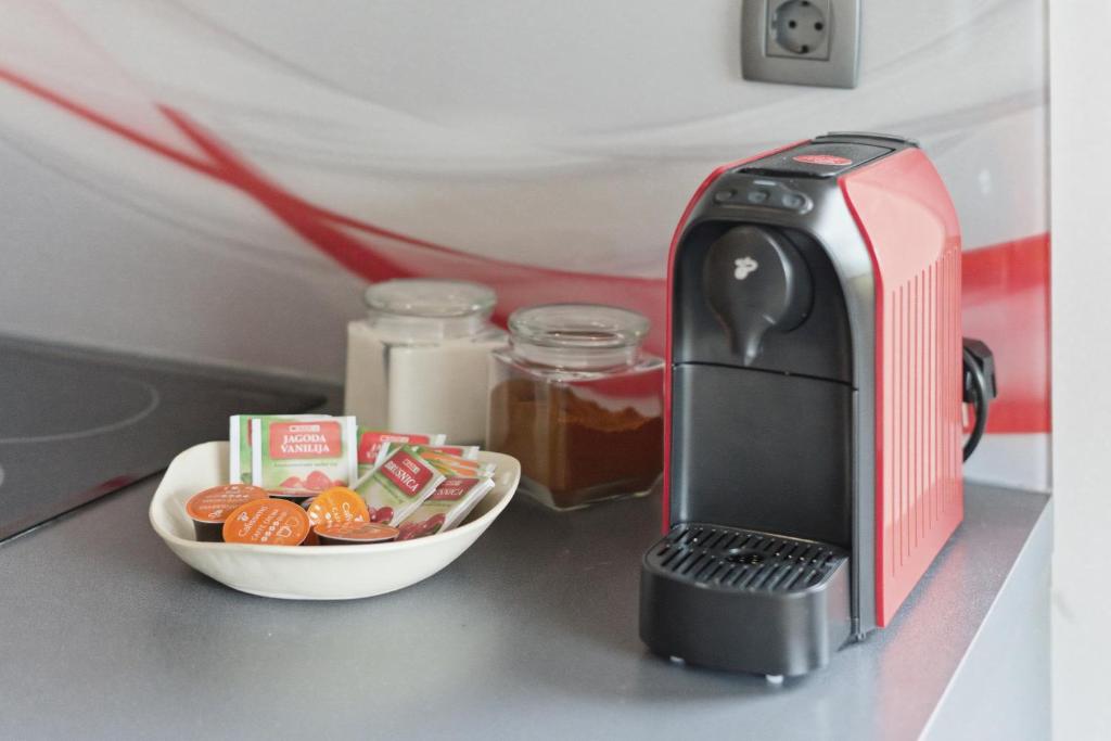 a toaster and a bowl of food on a counter at House Molnar in Kočevje