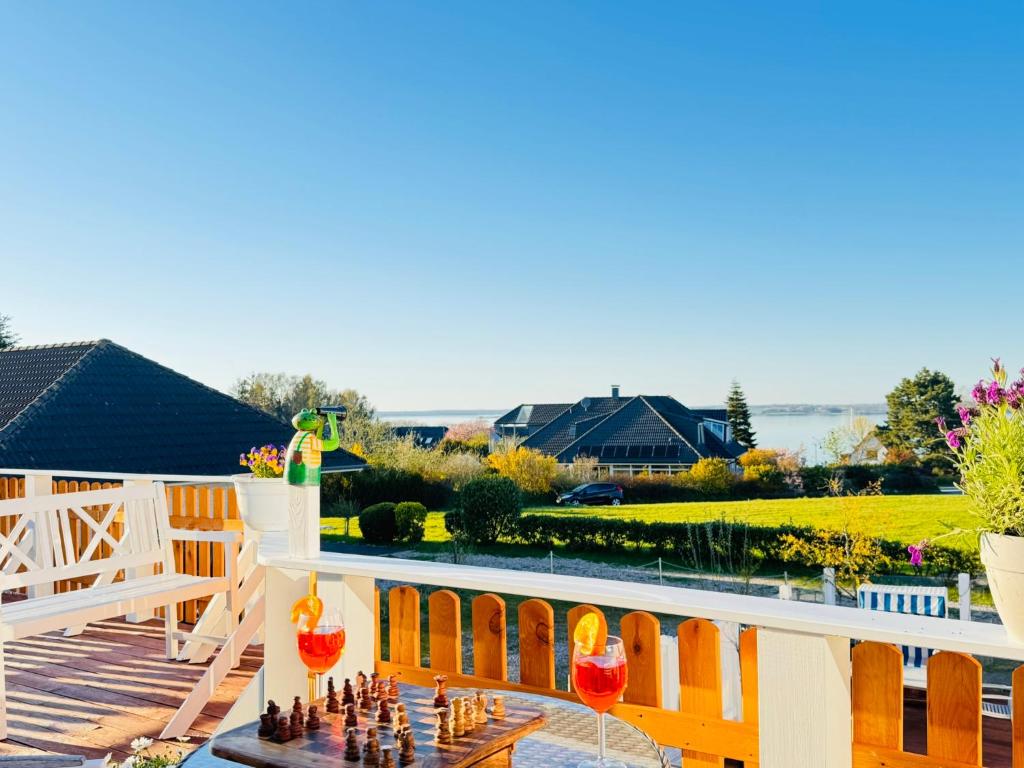 a backyard with a chess game on the deck at Nordkiek No 8 Für 4 Person mit Meerblick in Westerholz