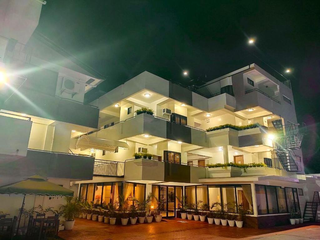 a large white building with many windows at night at ZKB Twins Hotel in General Santos
