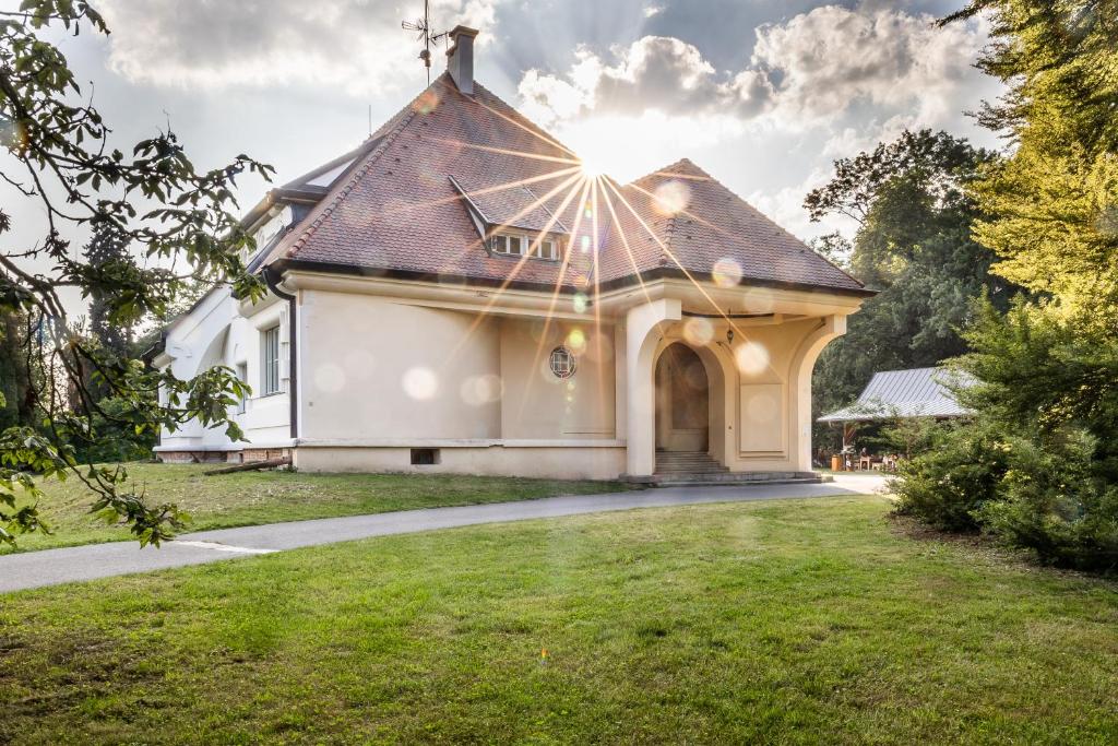 a small white house with a roof at Vila Háj in Úsov