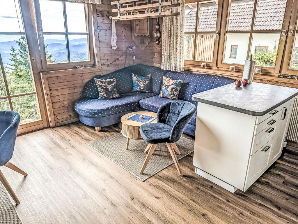 a living room with a couch and a table at Chalet Willegger by Interhome in Hochrindl