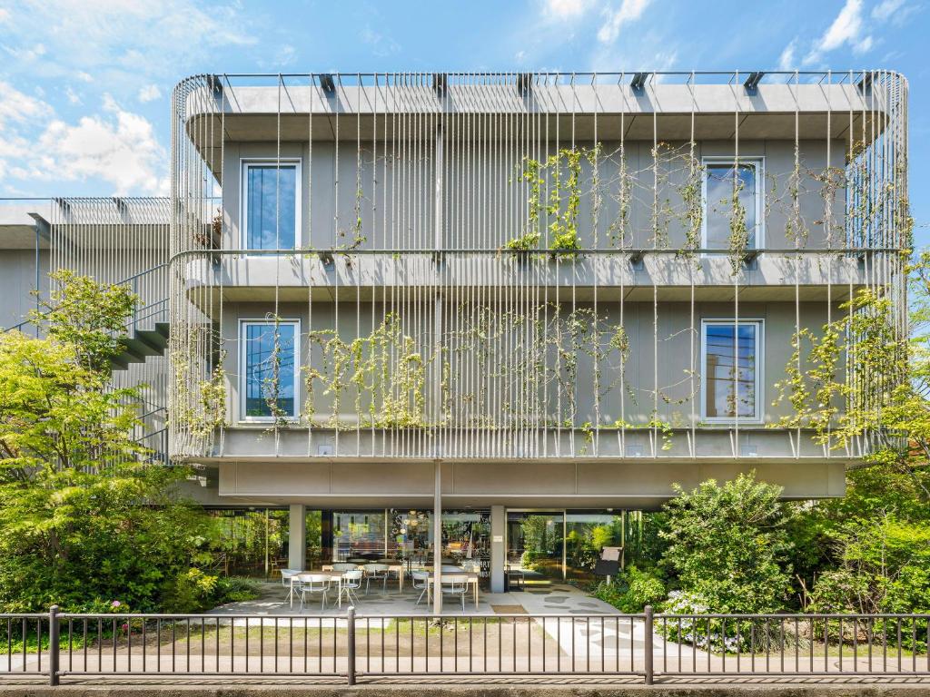 an external view of a building with a garden at LACER SUITES KAMAKURA -formerly kamakura seizan- in Kamakura