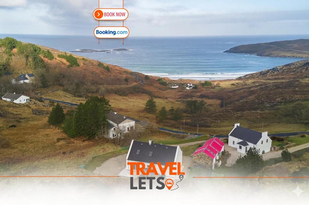 an aerial view of a house on a hill next to the ocean at 4 Bedroom House By Travel Lets Holiday Homes Downings With Beautiful Ocean View in Downings