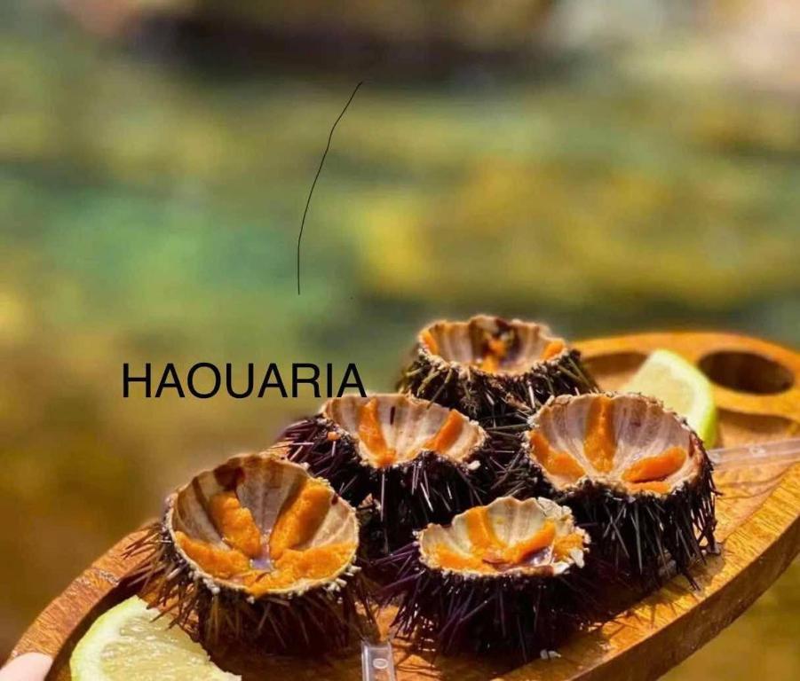 a group of durian fruits on a wooden plate at Haouaria PANTELLERIA in Sidi Amor