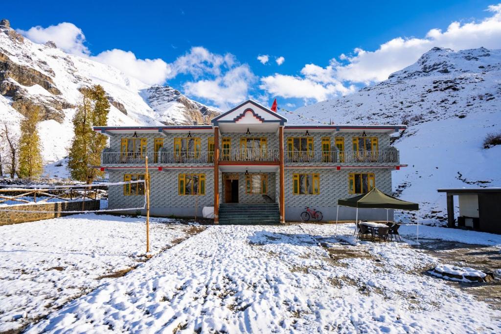 a house in the middle of a snowy mountain at PACK Sissu in Sissu
