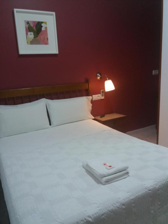 Cama ou camas em um quarto em Hostal Dulcinea