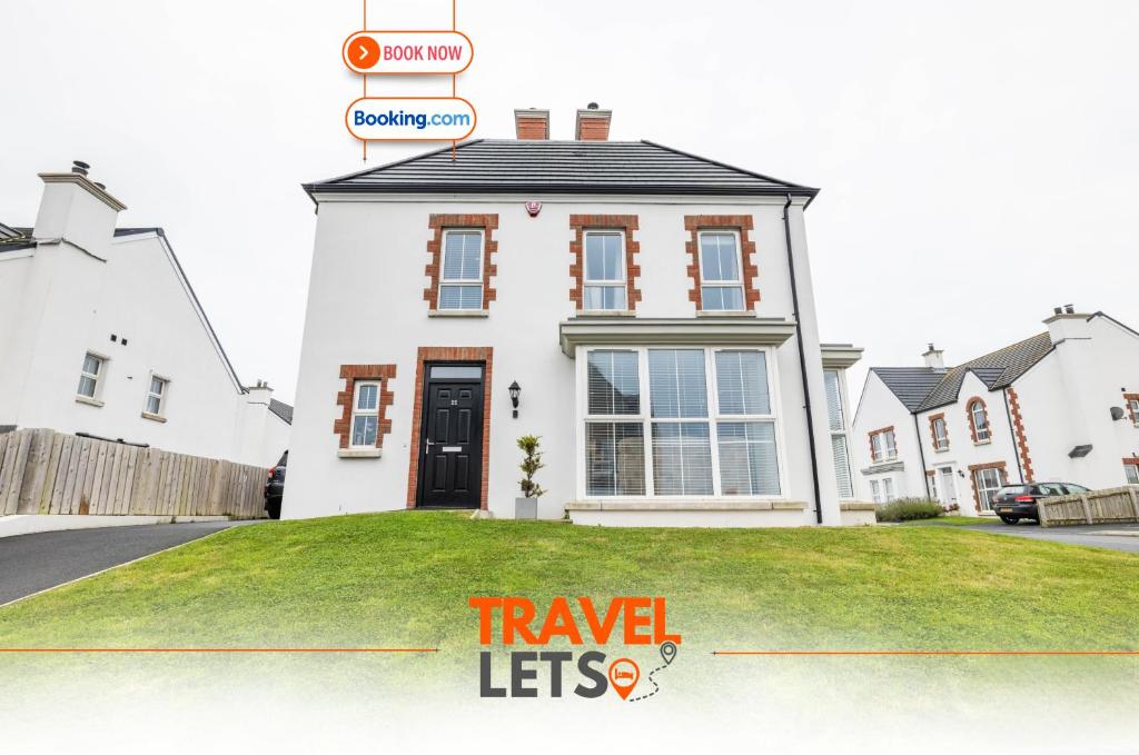 a house with a sign that reads travel lets at Four Bedroom By Travel Lets Holiday Homes Downpatrick With Sea View in Killyleagh