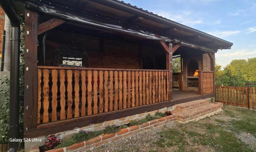 a wooden gazebo with a fence at Kuća za odmor Mia in Gornja Gračenica