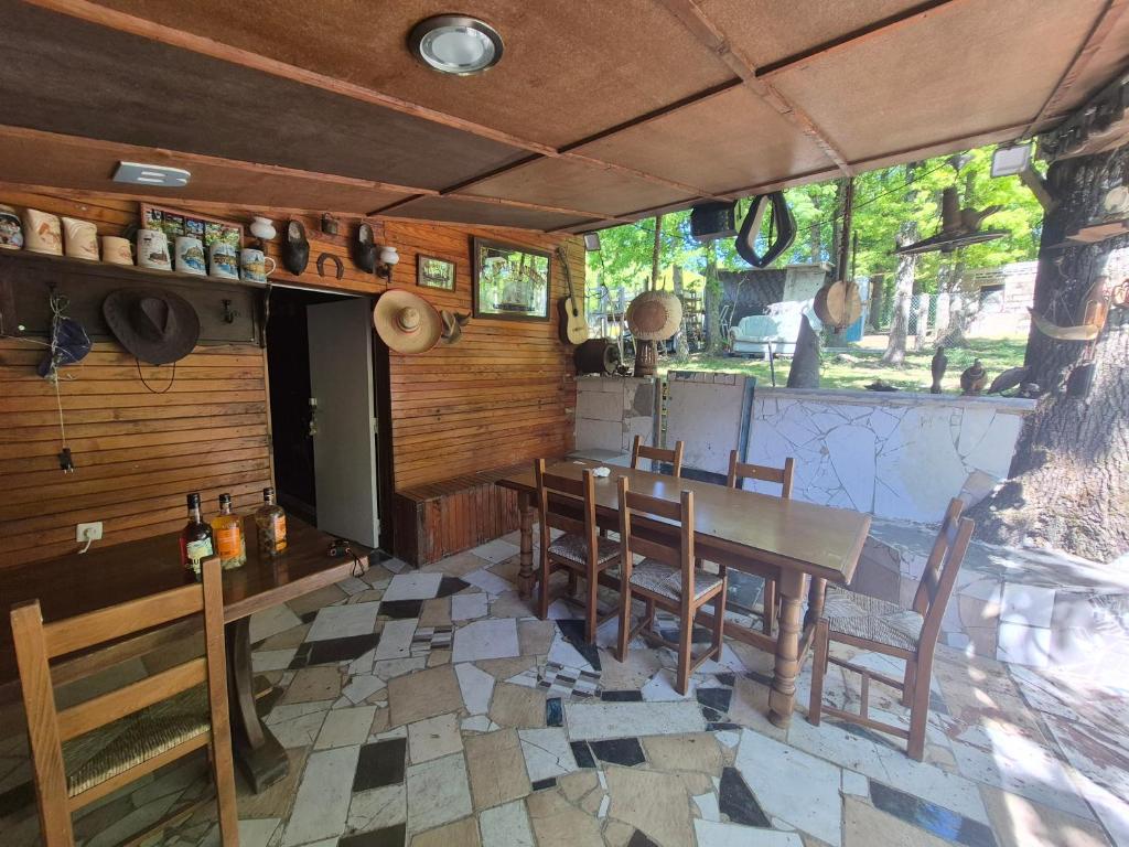 a dining room with a table and chairs at Chalet de la vallée in Souppes-sur-Loing