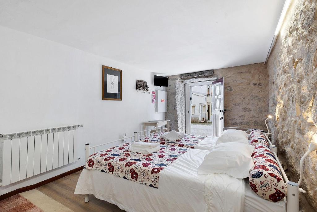 a bedroom with a bed in a room at Portas de Caminha I in Caminha