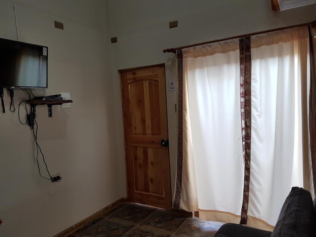 TV a/nebo společenská místnost v ubytování Vicuña Lodge