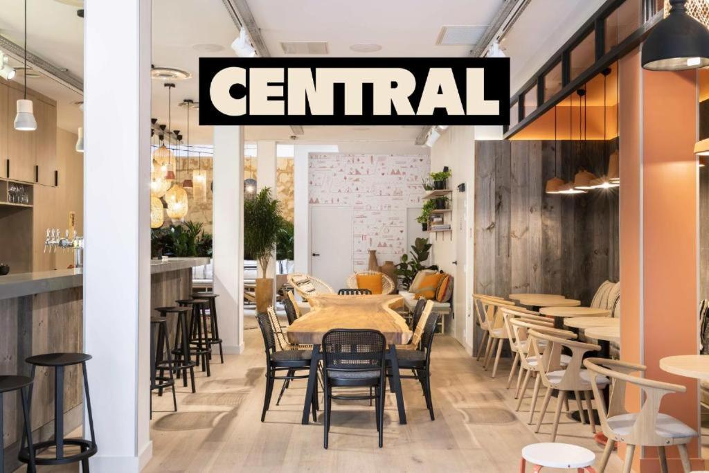 a restaurant with tables and chairs and a sign that reads central at CENTRAL Hôtel Bordeaux Centre in Bordeaux