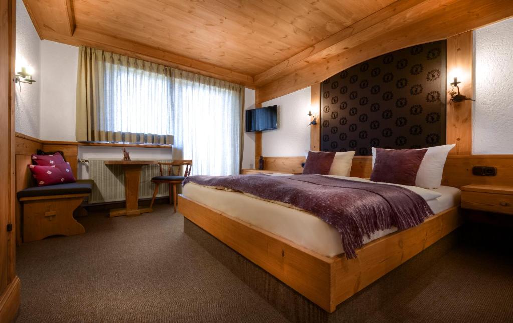 Postel nebo postele na pokoji v ubytování Dreimäderlhaus - Das vegetarische Boutique Hotel