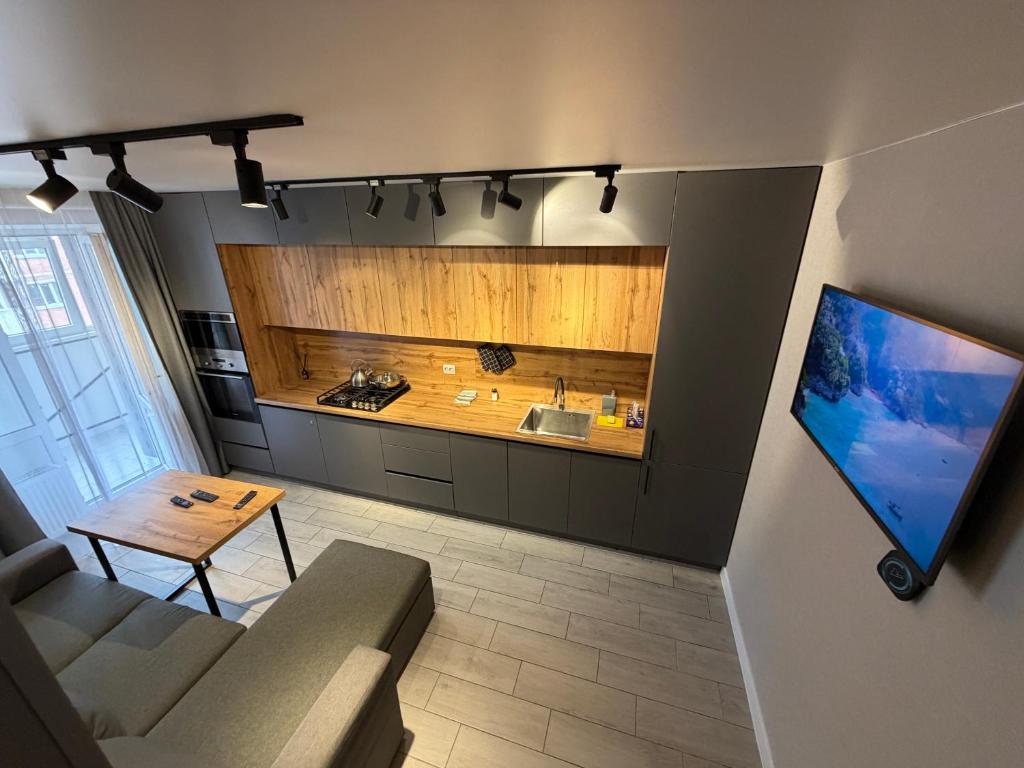a living room with a couch and a table at 2 кім кв BIG APARTMENT TOP Center in Sumy