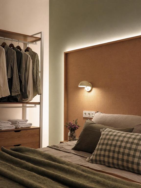 a bedroom with a bed with a headboard and a closet at Pension Nagusia in Basauri