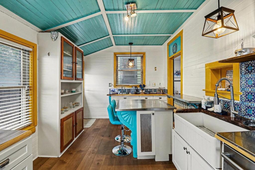 a kitchen with a blue ceiling and a sink at Lil' Red House On Porter in Detroit