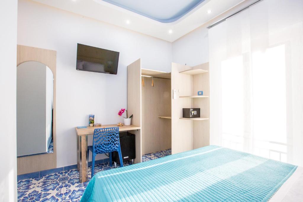 TV a/nebo společenská místnost v ubytování B&B Degli Aranci