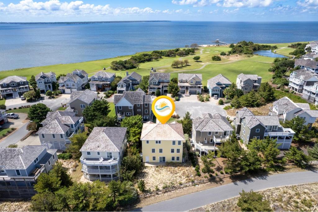 an aerial view of a residential neighborhood with houses at 6155 - Designed to Please in Nags Head