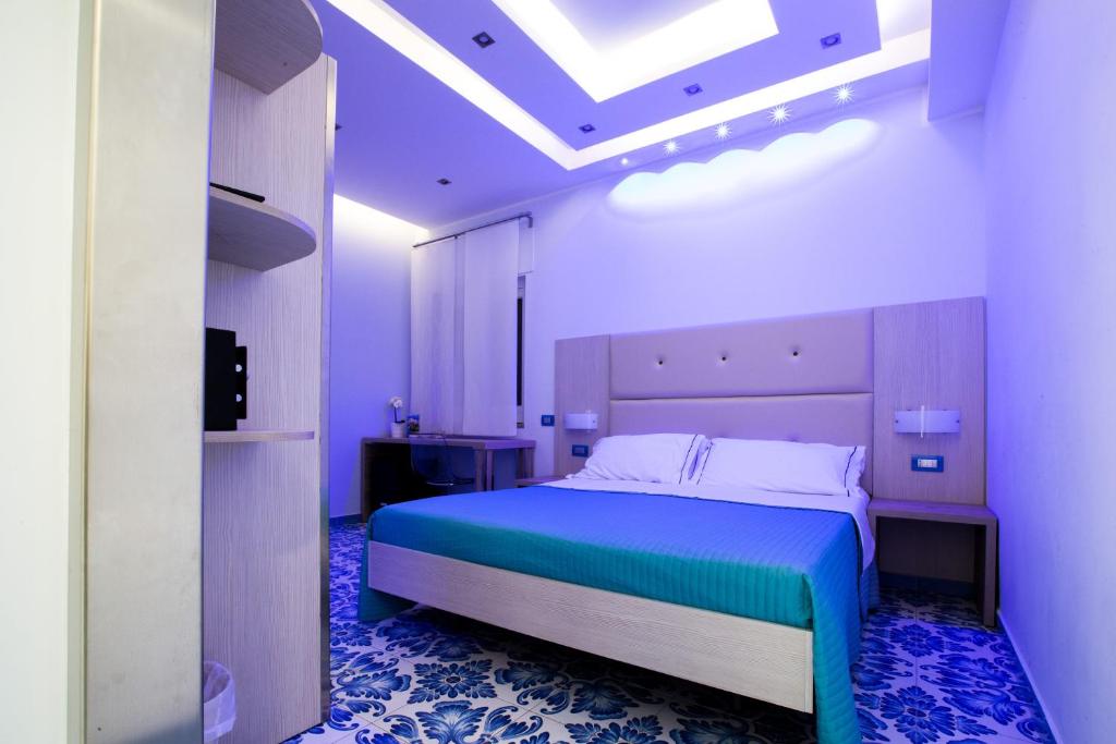 Postel nebo postele na pokoji v ubytování B&B Degli Aranci