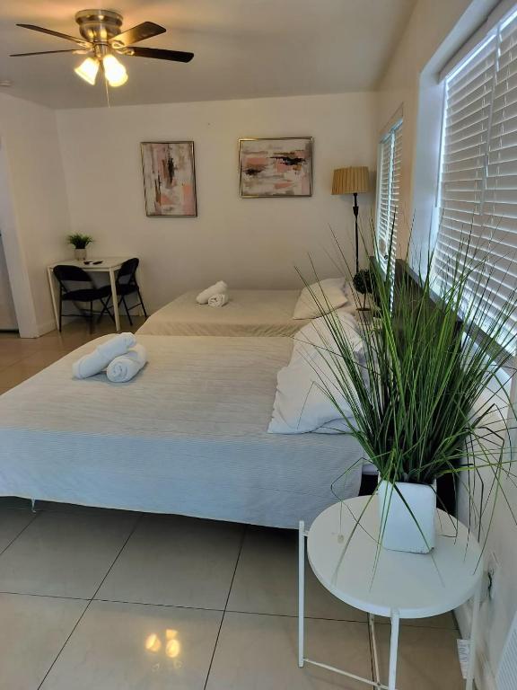 a bedroom with a large bed and a table at Comfortable Large Studio-J in Hollywood
