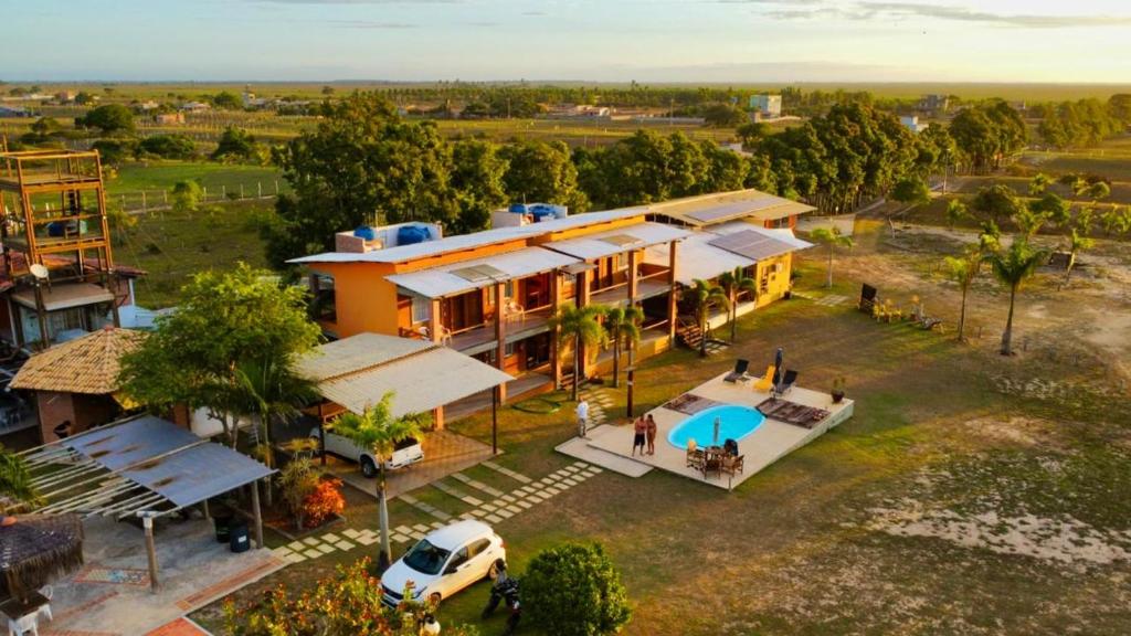 an aerial view of a house with a van in front of it at CAMALEÃO Ecopousada Ltda in Linhares