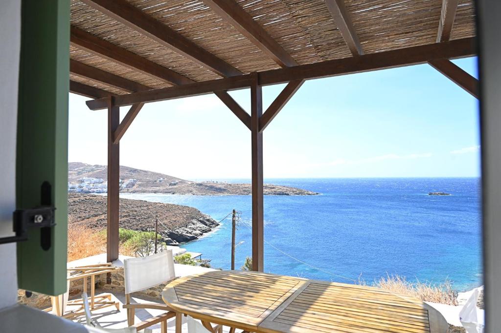 a view of the ocean from the porch of a house at Sto Faro - Green in Kithnos
