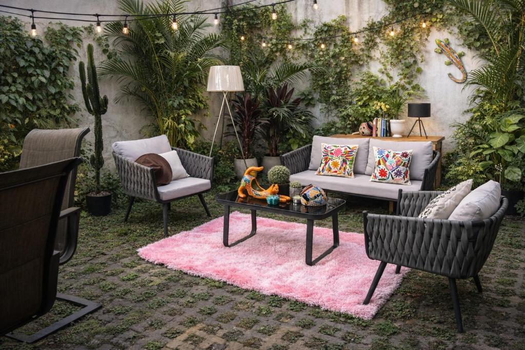 a living room with a couch and chairs and a table at Mariachi House in Mexico City