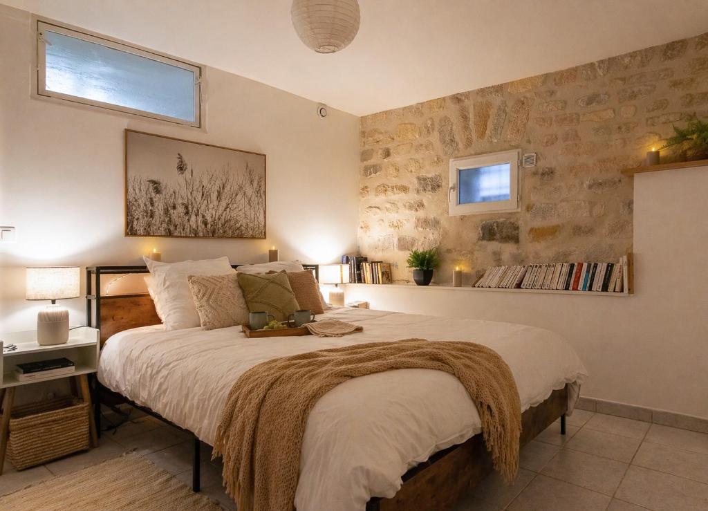 a bedroom with a large bed in a room at Le Michelet - Loft Cosy avec soirée cinéma Proche Vincennes in Montreuil