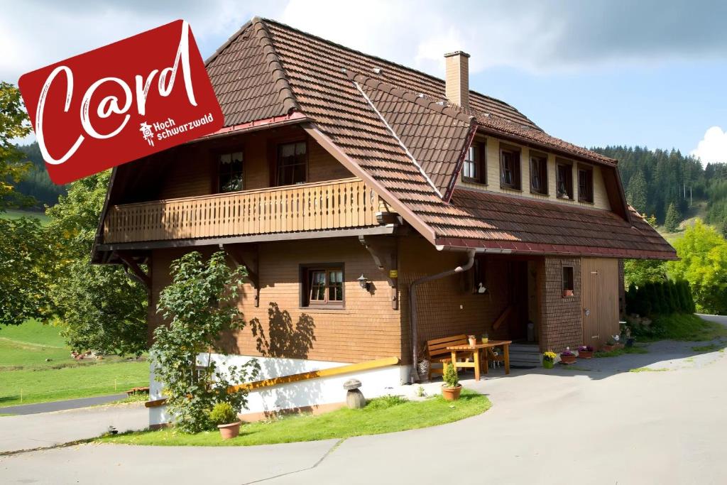 a log cabin with a cocacola sign on it at Oberes Wirtshaus in Titisee-Neustadt