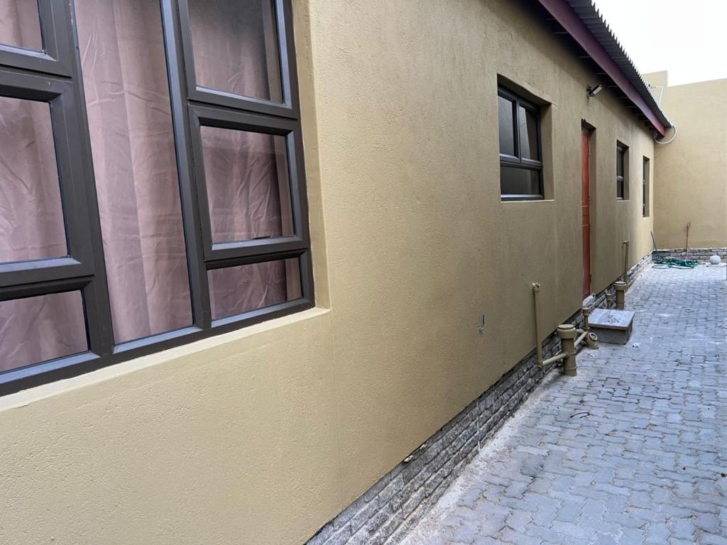 a building with windows on the side of it at J&A Corner - Swakopmund in Swakopmund