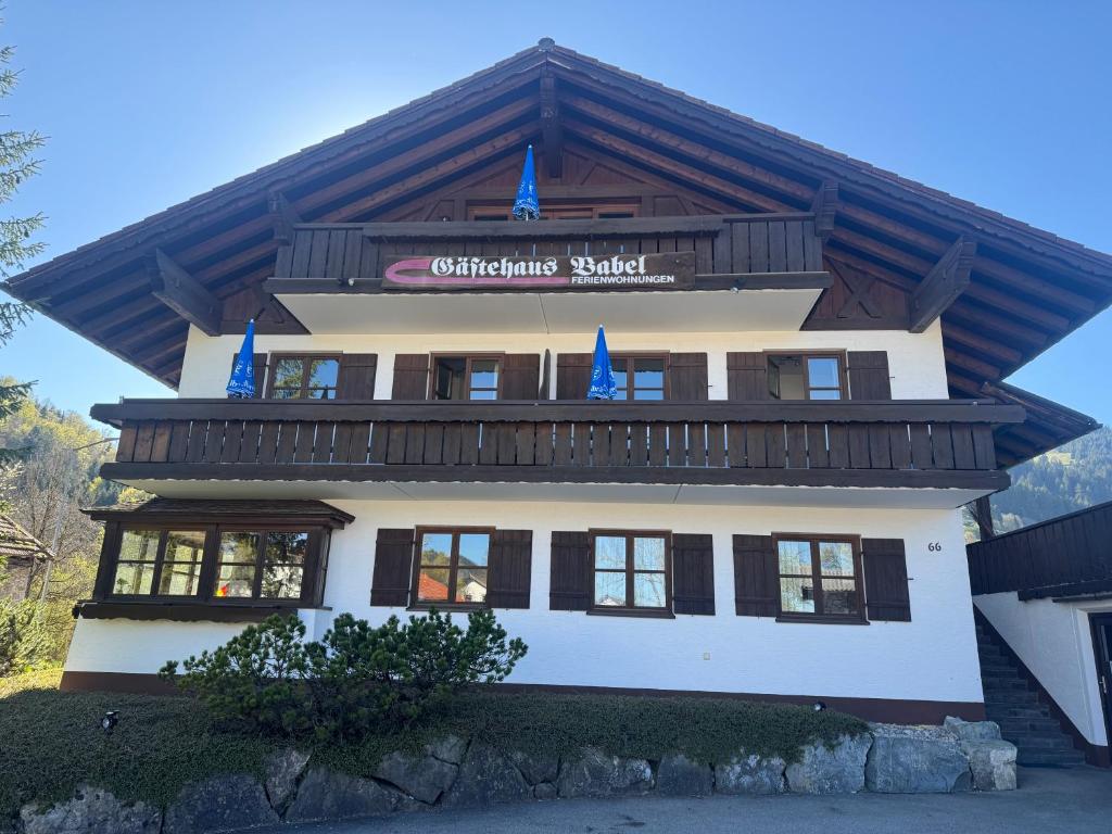 a building with a sign that reads christmas snack at Gästehaus Babel in Pfronten