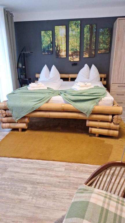 two twin beds in a room with windows at Apartment Schwarzwald mit Zugang Pool und Sauna in Schönwald
