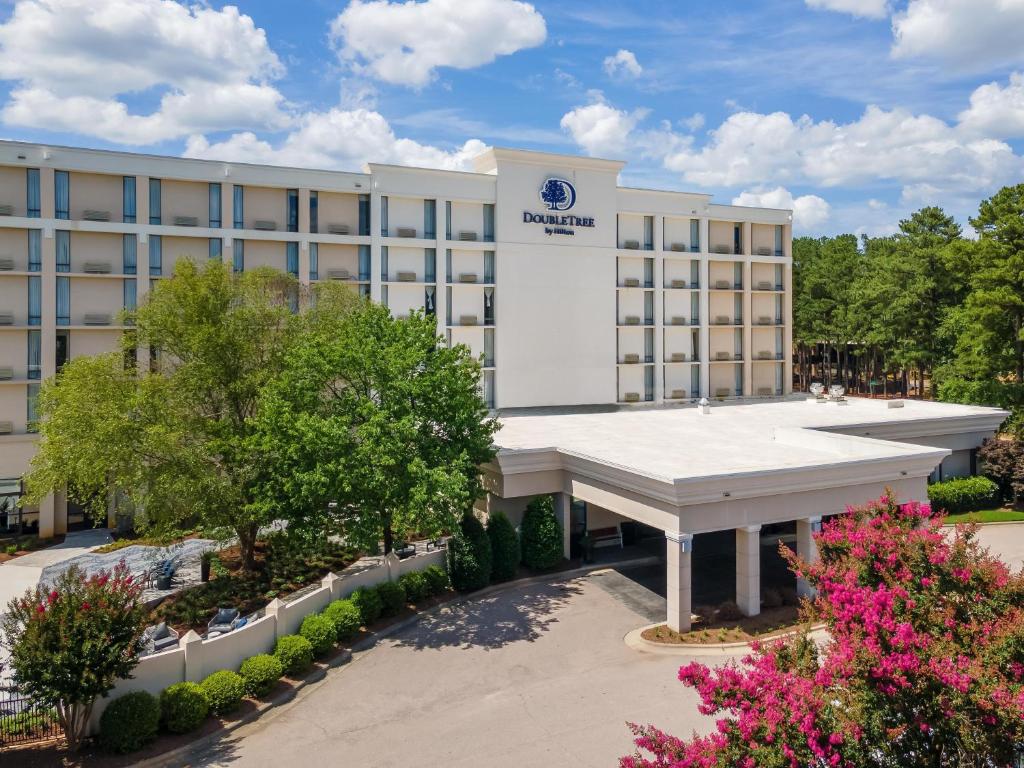 an image of the front of a hotel at DoubleTree by Hilton Raleigh Midtown, NC in Raleigh