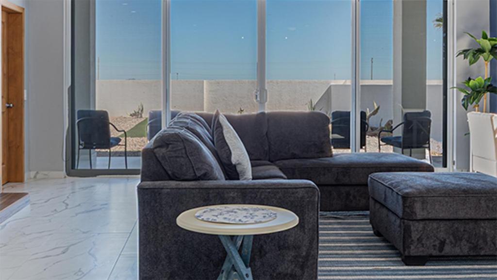 a living room with a couch and a coffee table at Casa Bonita Encantame Estates in Playa Encanto