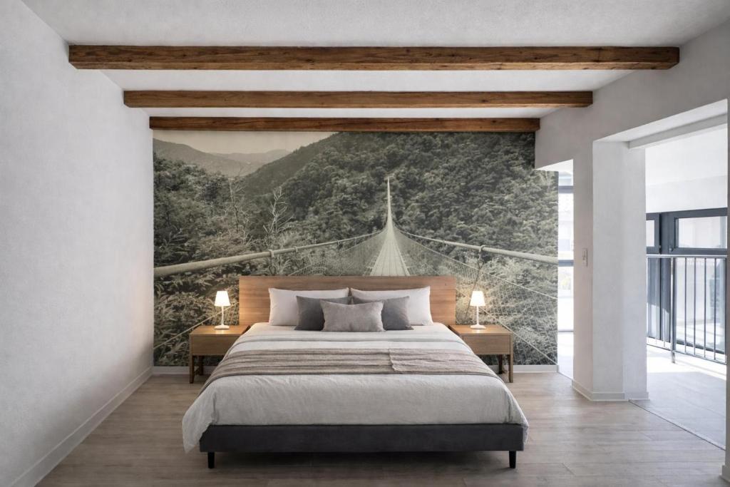 a bedroom with a large bed with a wall mural at Tibetan BB in Bellinzona