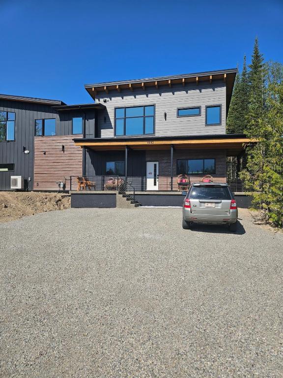 a car parked in front of a house at Fernie Alpine Retreat in Fernie
